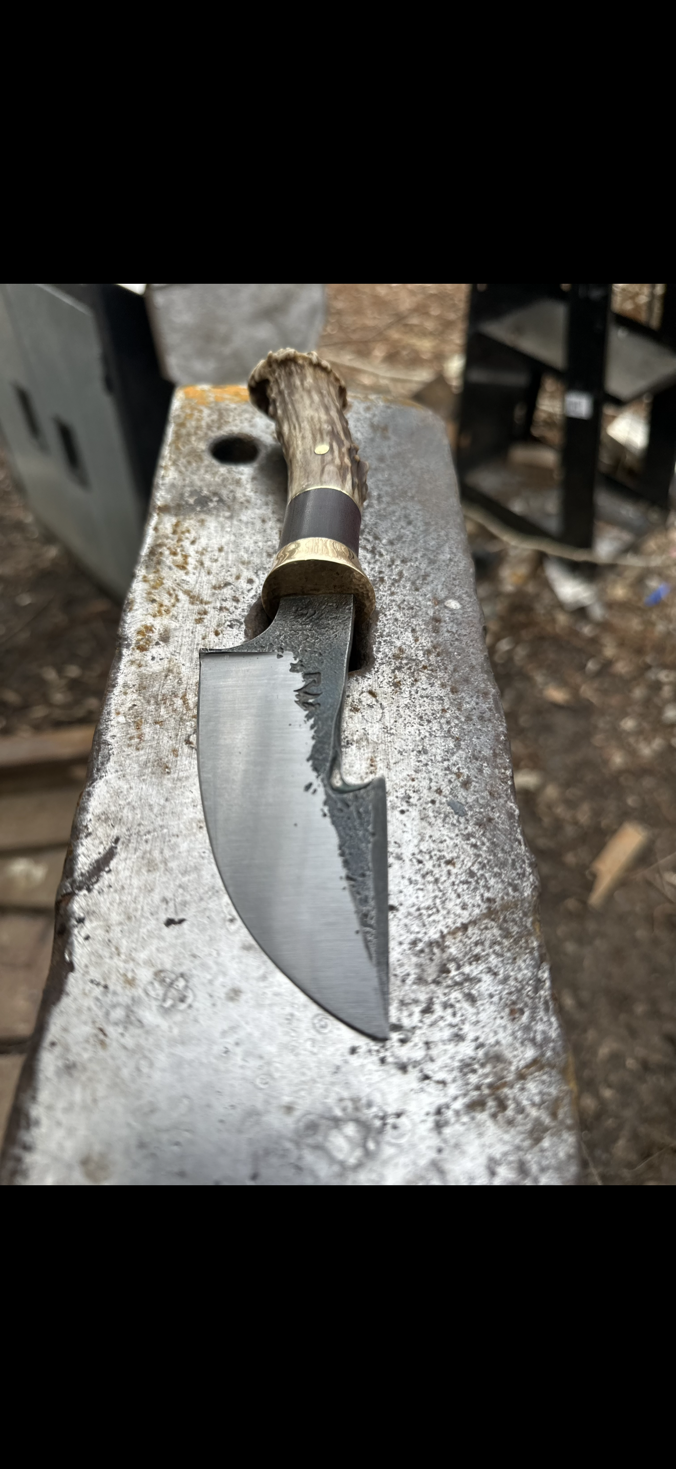 Trailing point hunter with antler handle on anvil